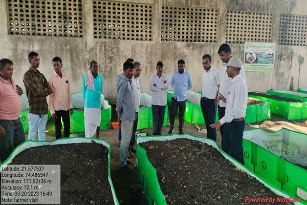 Farmers observing a practical agricultural demonstration